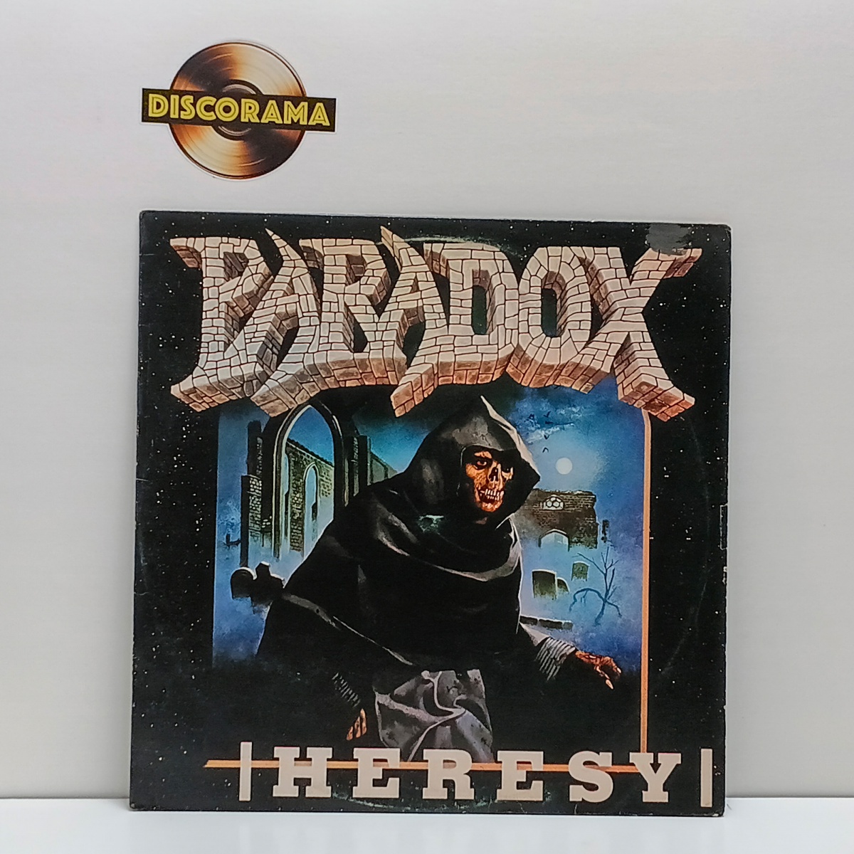 PARADOX   -  HERESY  -  ASPECTO DO DISCO: EXCELENTE  /  ASPECTO DA CAPA: VG+ (POSSUI DISCRETA AVARIA NO CANTO SUPERIOR DIREITO)  -  1989  -  LP DISCO DE VINIL (Verifique com atenção as imagens deste lote e entre em ...