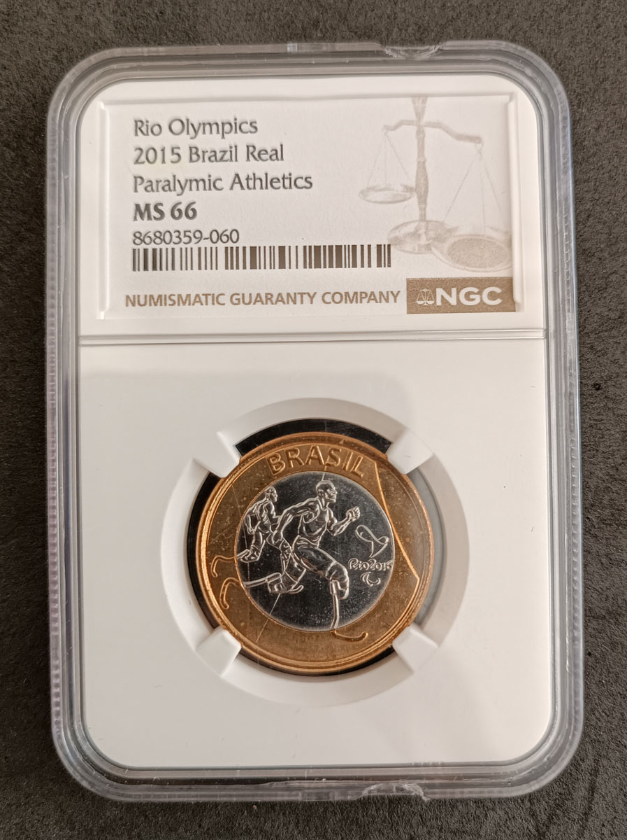 BRASIL - 1 REAL 2015 - MS66 - COMEMORATIVA AS OLIMPIADAS - ATLETISMO PAROLIMPICO - PEÇA ENCAPSULADA E GRADUADA PELA NGC