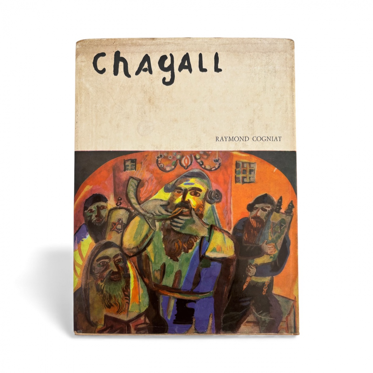 Livro Chagall de Raymond Cogniat, edição antiga ilustrada, com reproduções vibrantes das obras do artista, incluindo cenas emblemáticas em tons intensos de azul e vermelho. Capa original com sinais do tempo, charme ...