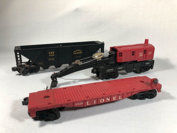 LIONEL TRAINS. Lote com três vagões de trens de brinque