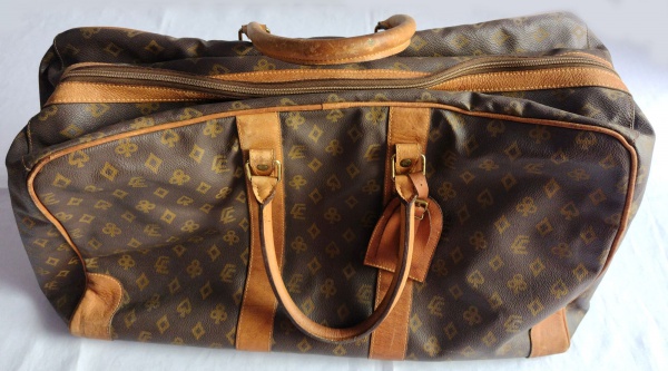 Louis Vuitton - Bolsa de viagem, em couro. Medindo: 31