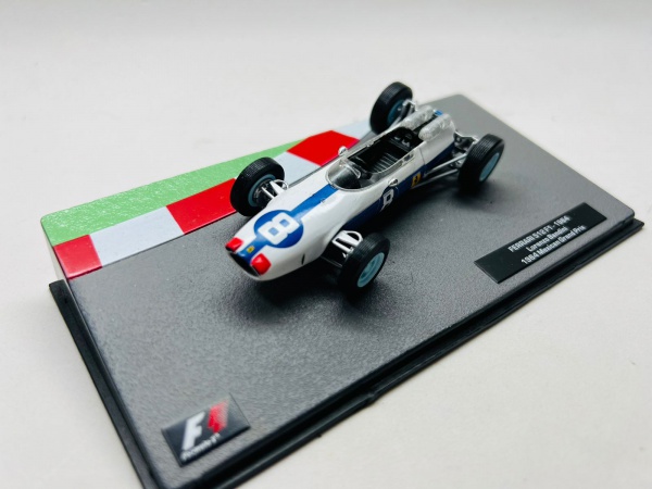 Miniatura Ferrari 512F1 1964 Lorenzo Bandini Mexican Grand Prix, Coleção Formula 1 metal diecast, escala 1/43. Acompanha base e acrilico originais. Itens no estado conforme fotos acrilico com marcas e pequeno trinco.