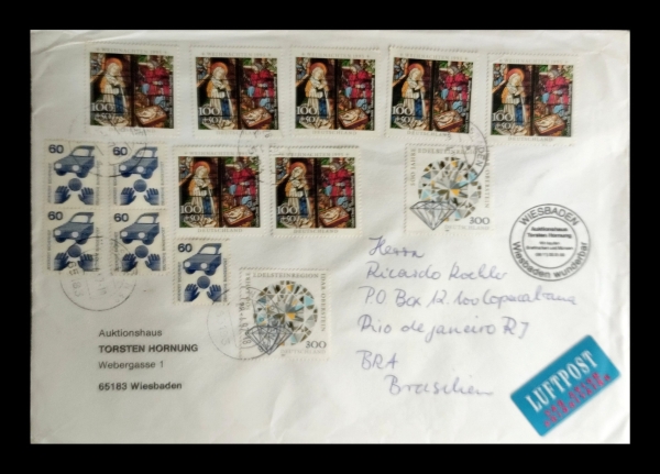 Envelope circulado da Alemanha com selos temáticos de Natal e pedras preciosas, contendo uma quadra