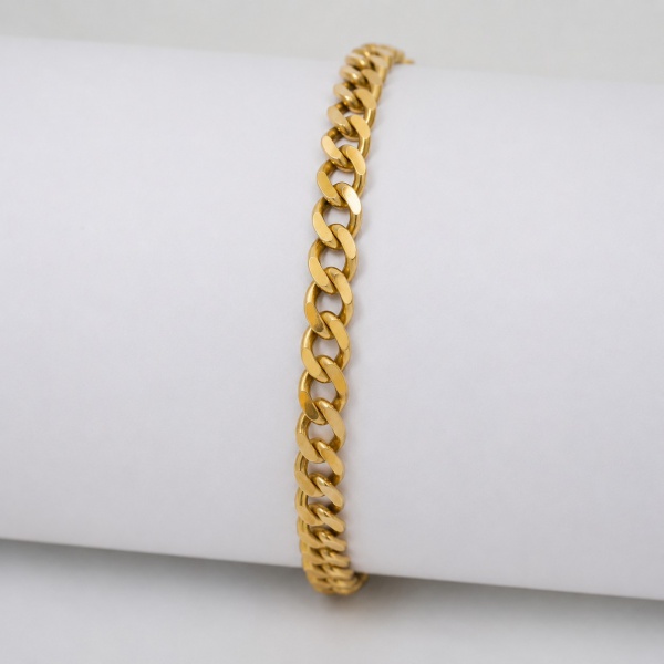 Pulseira em ouro 18 quilates (750/1000), elos grumet (curb link), fecho tipo fivela de segurança com gancho e argola de reforço, contrastes parcialmente visíveis na peça do fecho; peso: 12,2 g.