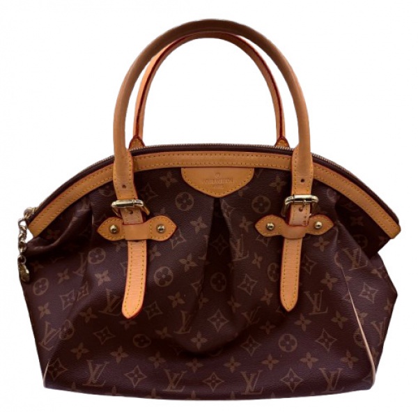 Bolsas . Louis Vuitton - Bolsa modelo Tivoli em canvas com logo da grife. Metais ...