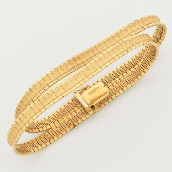 Joias . Pulseira bracelete em ouro amarelo 18 k, contrastada 750, em modelo duas tiras, ...