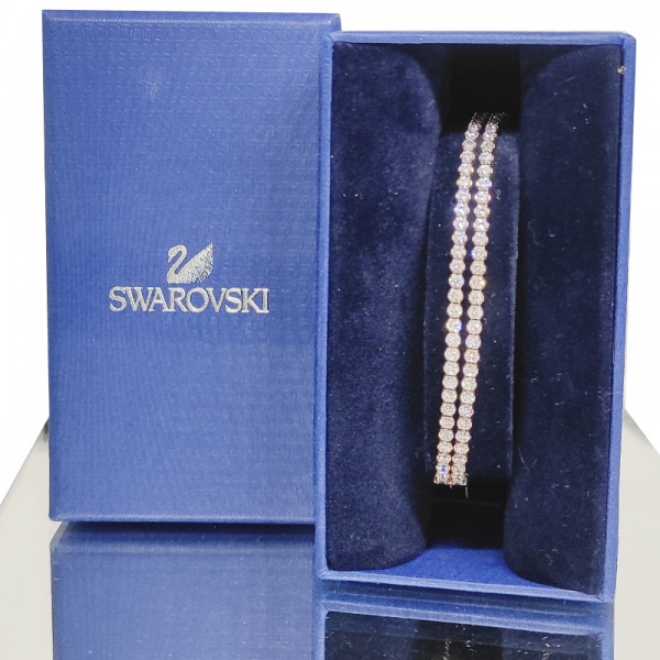 Joias . Swarovski - Pulseira com delicados cristais translúcidos e corpo revestido de ...