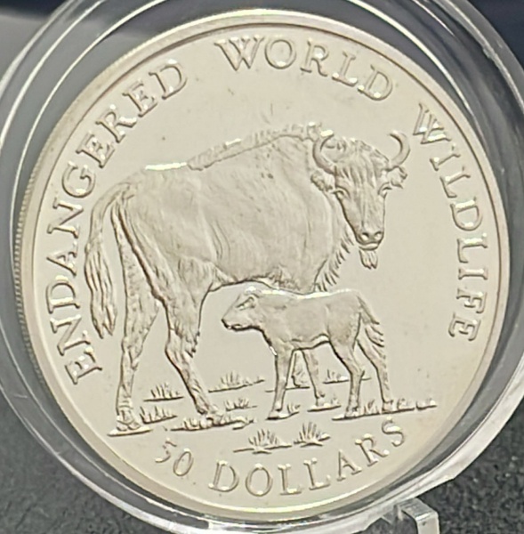 MOEDA DAs `ILHAS COOK` - 50 DOLLARS 1990 (ENDANGERED WORLD WILDLIFE) - PRATA .925% - DIAMETRO (+/-): 38,6mm.
