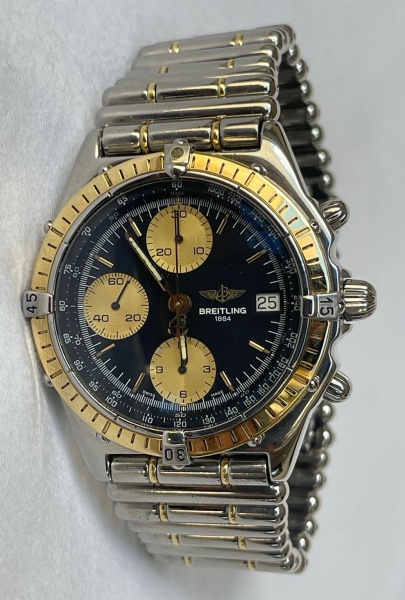 Relogio Breitling Chronomat, caixa de aço e ouro 39 mm, movimento automático, Visor de saphira, mostrador azul, pulseira de aço e ouro, fecho de aço duplo, reserva de corda de 42 horas, cronógrafo, da