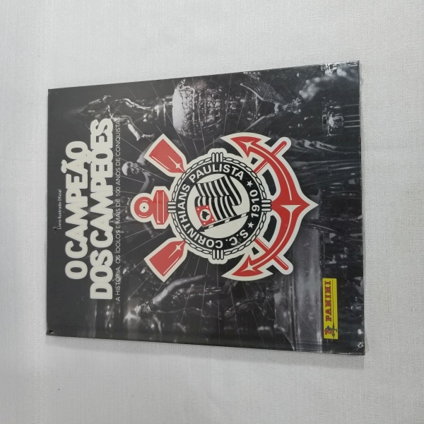 Álbum O CAMPEÃO DOS CAMPEÕES Corinthians Panini (Lacrado). Caso as informações descritas neste lote não sejam suficientes para sanar suas dúvidas, mande um WhatsApp para (11) 91264-3806 ou envie um e-