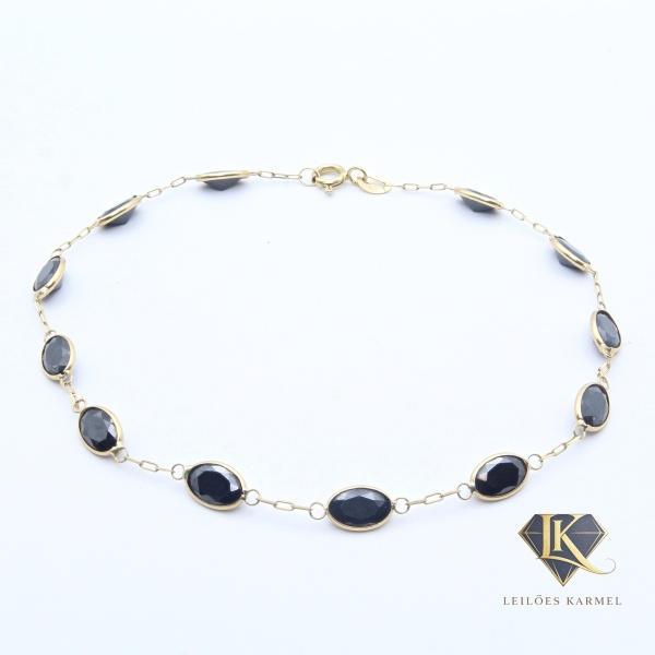 Pulseira em Ouro Amarelo 18K com pedras sintéticas lapidação navete, 18cm de comprimento, Peso de 2.3 gr. Acompanha Certificado de Garantia Leilões Karmel.