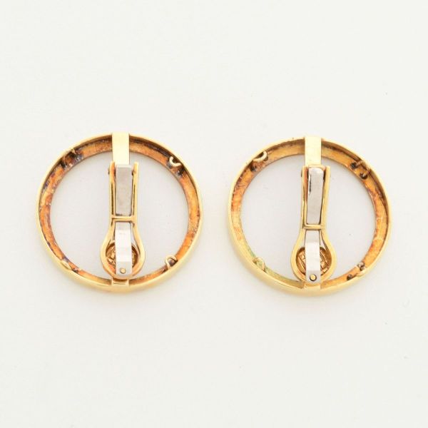 Par de castões em ouro amarelo 18 k, para moedas, adaptados para par de brincos de pressão. Diâmetro 25 mm. Peso 13,3 g.