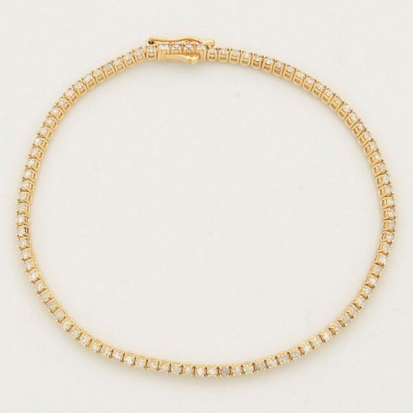 Pulseira em ouro amarelo 14 k, modelo Riviera, cravejada com 90 diamantes, medindo 18,0 cm. Peso 5,0 g.