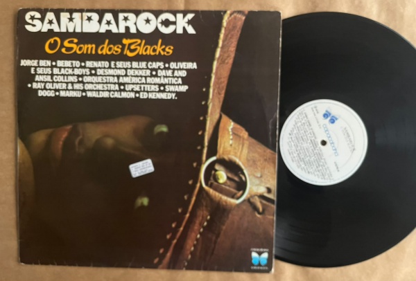 LP: Artista: Sambarock o som dos Blacks / Album: Sambarock o som dos Blacks, coletânea | Selo: Copacabana | Cód: COELP-41 575Capa (VG): Muito Bom: marcas superficiais, com detalhes visuais; pode conte