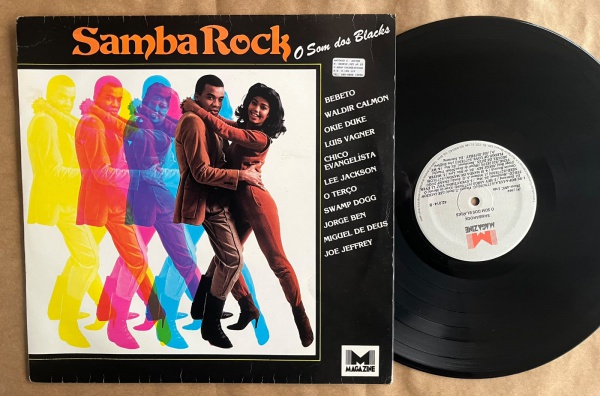 LP: Artista: Sambarock o som dos Blacks / Album: Sambarock o som dos Blacks, coletânea | Selo: Magazine | Cód: 42 014Capa (VG): Muito Bom: marcas superficiais, com detalhes visuais; pode conter leve r