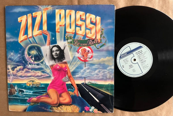 LP: Artista: Zizi Possi / Album: Zizi Possi em "Dê um rolê" | Selo: Philips | Cód: 824 025-1Capa (VG -): Muito Bom: marcas superficiais, com detalhes visuais; pode conter leve rasura como um nome; lev
