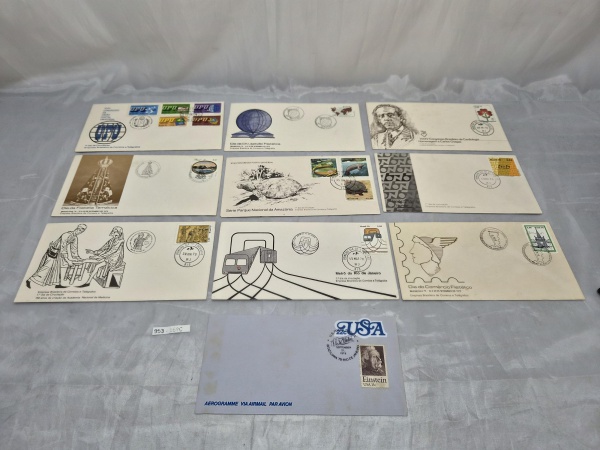 Lote composto por 10 peças filatélicas, incluindo 09 envelopes de Primeiro Dia de Circulação (FDC) dos Correios do Brasil e 01 aerograma dos EUA referente à exposição Brasiliana 79, contendo selos e c