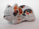 Paliteiro em porcelana na forma de gato.