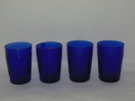 Lote composto de (4) copos para cachaça em vidro, no tom azul.