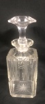 Garrafa de cristal , possivelmente Baccarat , lapidação com palmas, círculos e estrelas, medindo 24 cm alt.