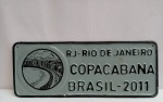 Placa Comemorativa Rio de Janeiro Copacabana Brasil 2011, aprox. 34 x 13,5cm, alto relevo, apresenta marcas do tempo, vendido no estado