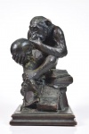 Assinatura não identificada . "Teoria da Evolução de Charles Darwin" . Escultura em fina camada de bronze sobre base de madeira. Marcas do tempo.  Med.: 29 x 35 cm.