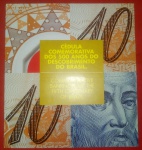 Folder com cédula de 10 reais plástica, comemorativa, n° A001024199D, Pedro A. Cabral