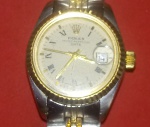 Relógio Feminino Rolex!! Pulseira com 2 cores!!! Fundo trocado da caixa!! , não possuimos nota fiscal que garante procedencia .