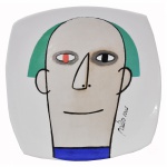 Gustavo Rosa - Prato em porcelana decorado com rosto de homem. 23 cm.