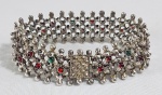 ÍNDIA  - Pesada pulseira em prata de Lei (contrastada) com pequenos  cabuchons de pedras vermelhas e verdes. Med. 20 cm