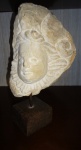 Nicola - Escultura em pedra calcaria "Anjo", sobre base de madeira, medindo: 30 cm de altura, peça assinada no verso e datada de 1996.