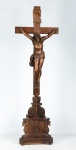 ARTE SACRA - "Cristo Crucificado" -  " VINOT - 1822", Fabuloso crucifixo francês do Séc. XIX confeccionado em carvalho com riquíssimo trabalho de entalhe feito a mão, na base passagens litúrgicas, ao centro "Cristo Crucificado" com cravos em ferro, imagem de rara beleza, assinada e datada na base.  Med.: 1,22 x 40 cm.