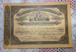 Apólice nº 00.438 do BANCO DOS COMMERCIANTES no valor de 100 mil Réis datada de janeiro de 1890. Mede 19 x 27,5 cm.