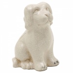 Cachorro em porcelana com efeitos craquelados. Medida 19 cm de altura.
