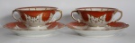 VISTA ALEGRE - Par de xícaras/consome em porcelana esmaltada portuguesa com marca de sua manufatura em sua base nas cores branca, vermelha e dourado.  Medida: 10 cm x 12,5 cm x 5,5 cm; Pires: 15 cm de diâmetro