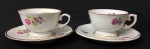 Schmidt - Duas xícaras para café em porcelana nacionalna cor branca com decoração floral e frisos dourados. Medida 7 x 4,5 cm.