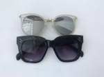 Dois lindos óculos femininos para sol, um na cor prateada e outro na cor preta.