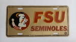 Placa Decorativa FSU SEMINOLES "Time Basquete Masculino Florida State", executado em metal, alto relevo; aprox. 30 x 15cm, marcas do tempo, segue conforme apresentado nas fotos