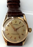 Relógio Rolex Oyster Perpetual, Cronômetro, automático, década 50, caixa de 29 mm de diâmetro de ouro rosé, original, em perfeito estado de conservação, pulseira de crocodilo