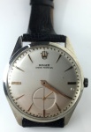 Relógio Rolex movimento a Corda, década 60, máquina e mostrador originais, em perfeito estado de funcionamento e conservação, caixa de aço inox de 34mm de diâmetro adaptada