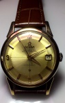 Relógio Omega Automático Cronômetro Constelletion, caixa de aço folheada a ouro de 35 mm de diâmetro, mostrador `guarda chuva` em perfeito estado de conservação e funcionamento, década de 70