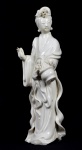 Bela escultura  de  porcelana dita "blanc de chine", representada por Kuan Yin carregando cesto. Med. 33 cm x  11 cm x  9 cm de profundidade. Marcas do tempo. pequenas faltas com perdas de substância.Perda na base. No estado.