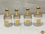 4 Perfumeiros vazios em vidro. Medindo 13,5cm de altura.