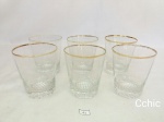 6 copos de aperitivo em demi cristal com bordas filetadas a ouro. Medida: 9cm de altura x 7cm de diametro de boca. Todas as peças apresentam desgaste na douração