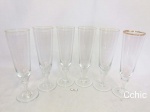 6 taças flutes em demi cristal com bordas filetadas a ouro. Medida: 16,5cm de altura.Todas as peças apresentam desgaste na douração