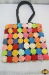 Bolsa tiracolo em tecido com fuxico de diversas cores, fechamento com zipper. Medindo 35cm x 33cm.