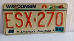 Placa automotiva americana, Wisconsin, America´s Dairyland, conforme fotos; aprox. 30,5 x 15,5cm