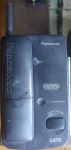 Antigo telefone Panasonic, não testado, com marcas do tempo.