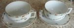Duas xícaras de chá em porcelana portuguesa , com delicados desenhos florais, com nome gravado  Norma e Jose. -Diâmetro:  10 cm