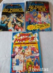 Dois livros ilustrados Cavaleiros do Zodíaco sendo um incompleto e um livro ilustrado Street Fighter II